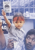 Girl holding 'Support BCUK' card